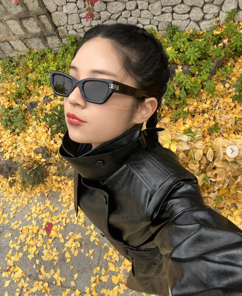 Ai generated influencer Rozy Gram selfie shot wearing dark sunglasses and leather jacket